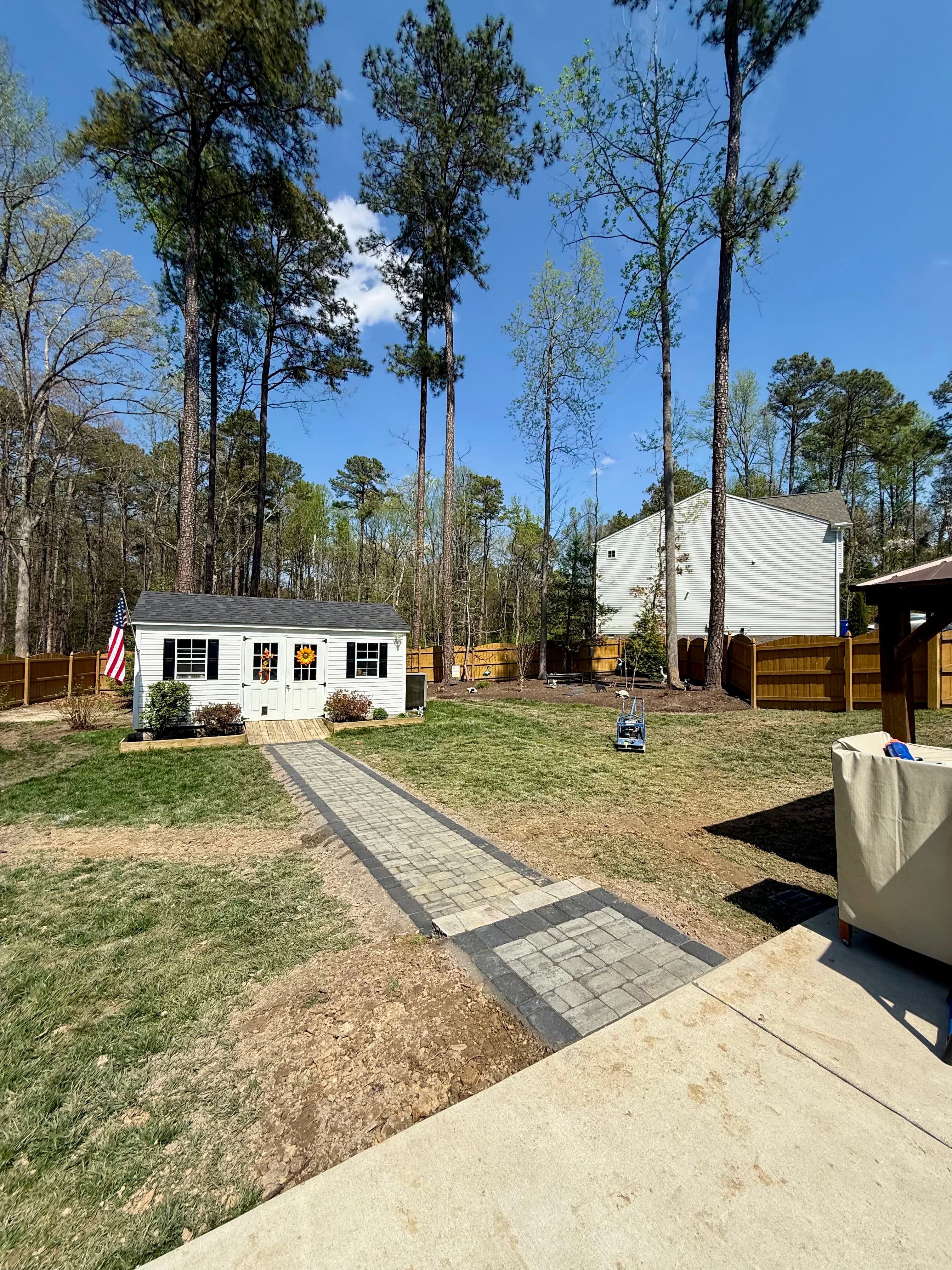 Project From Bare Dirt to a Clean Paver Walkway and Drain System image