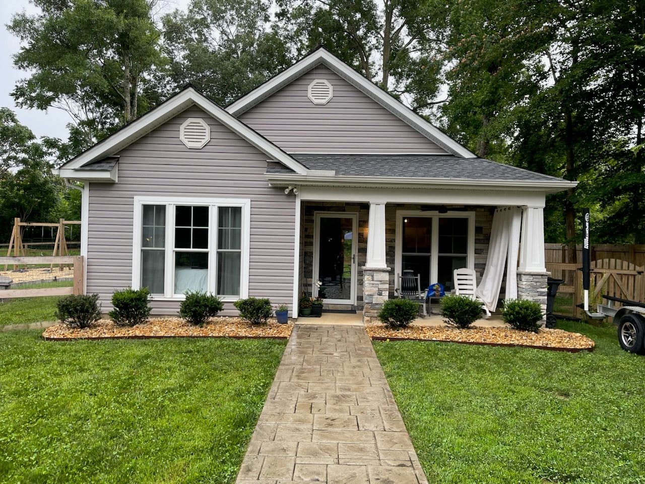 River Rock Landscaping Installation at Cozy Residential Property